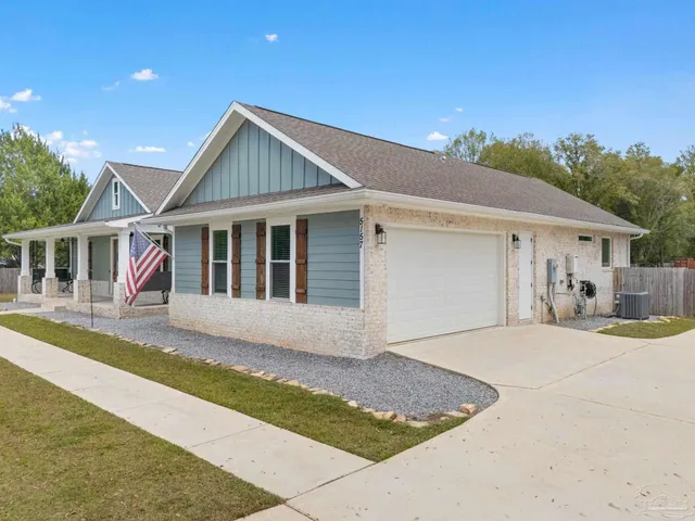 a view of livingroom with furniture flat screen tv and wooden floor