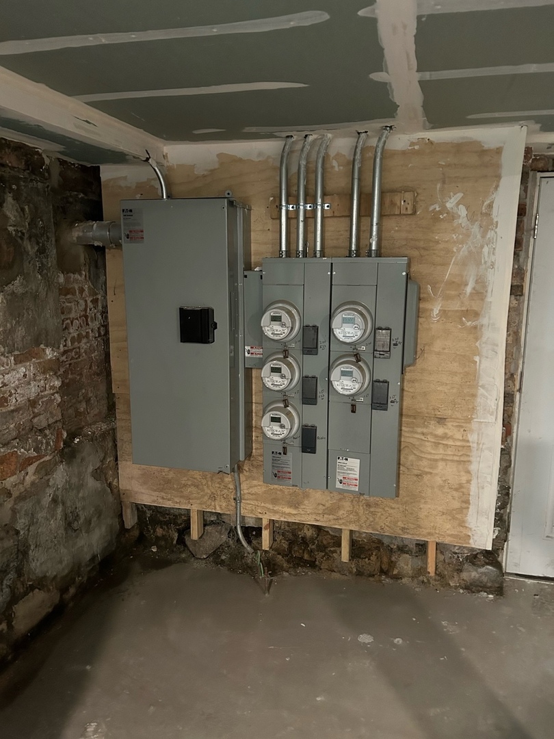 523 West 65th Place Chicago, IL 60621 - Photo 12 of 19 a front view of a house with parking area