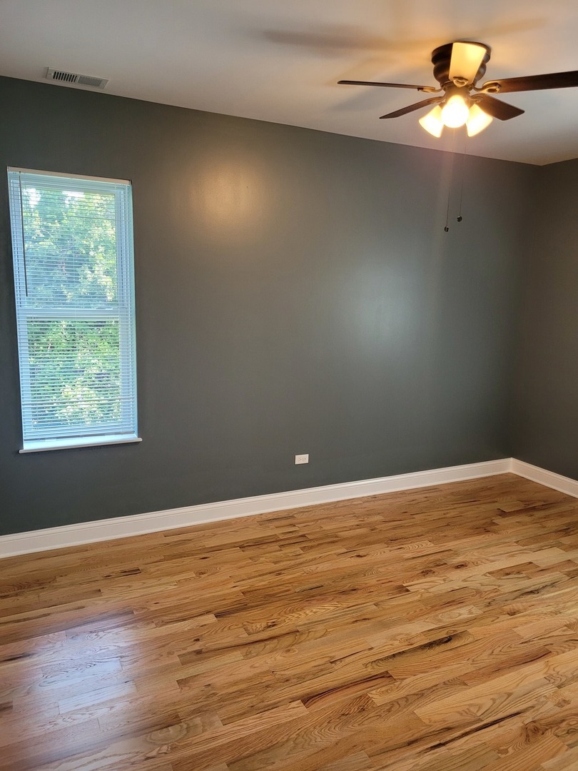 523 West 65th Place Chicago, IL 60621 - Photo 6 of 19 a view of an empty room with a window