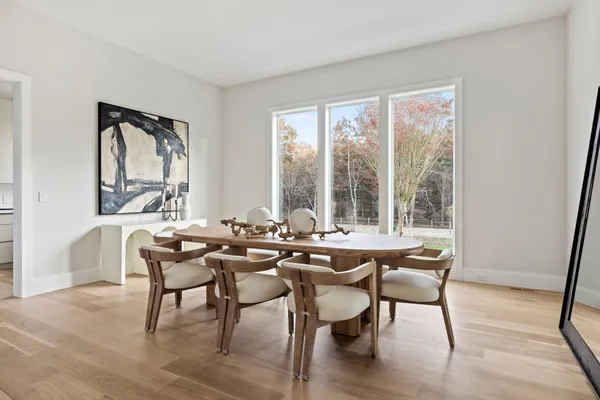 a view of a dining room with furniture and window
