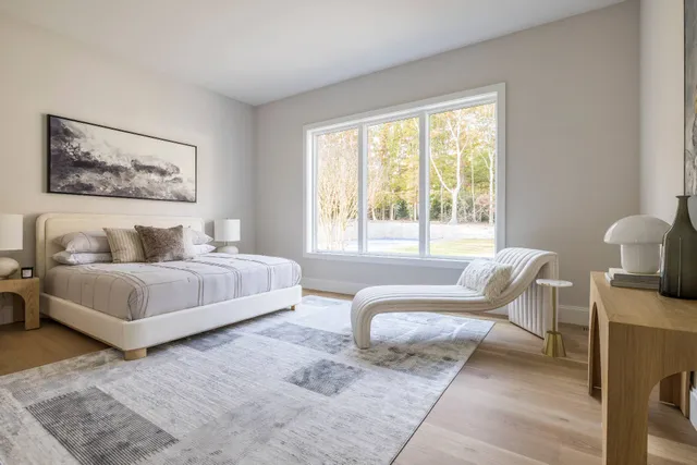 a spacious bedroom with a bed and a couch