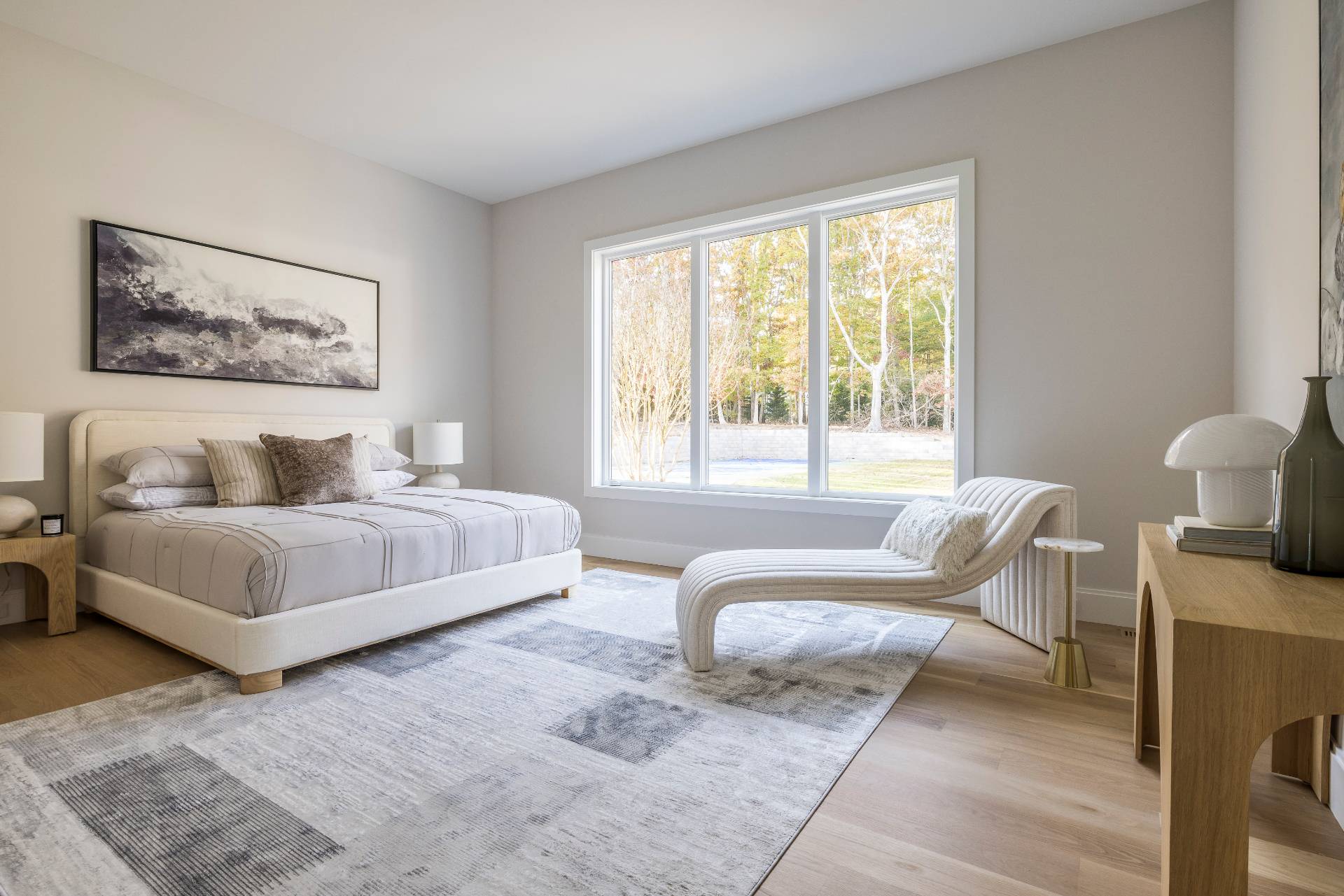 2069 Deerfield Road Sag Harbor, NY 11963 - Photo 16 of 37 a spacious bedroom with a bed and a couch