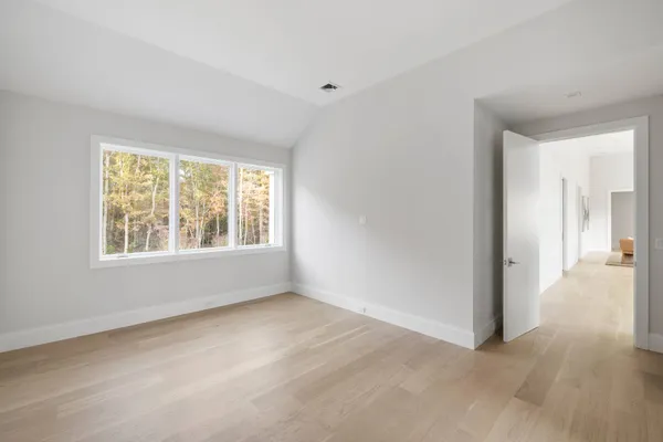 a view of an empty room with a window