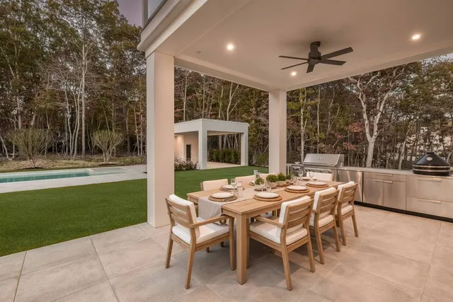 a view of a patio with a backyard