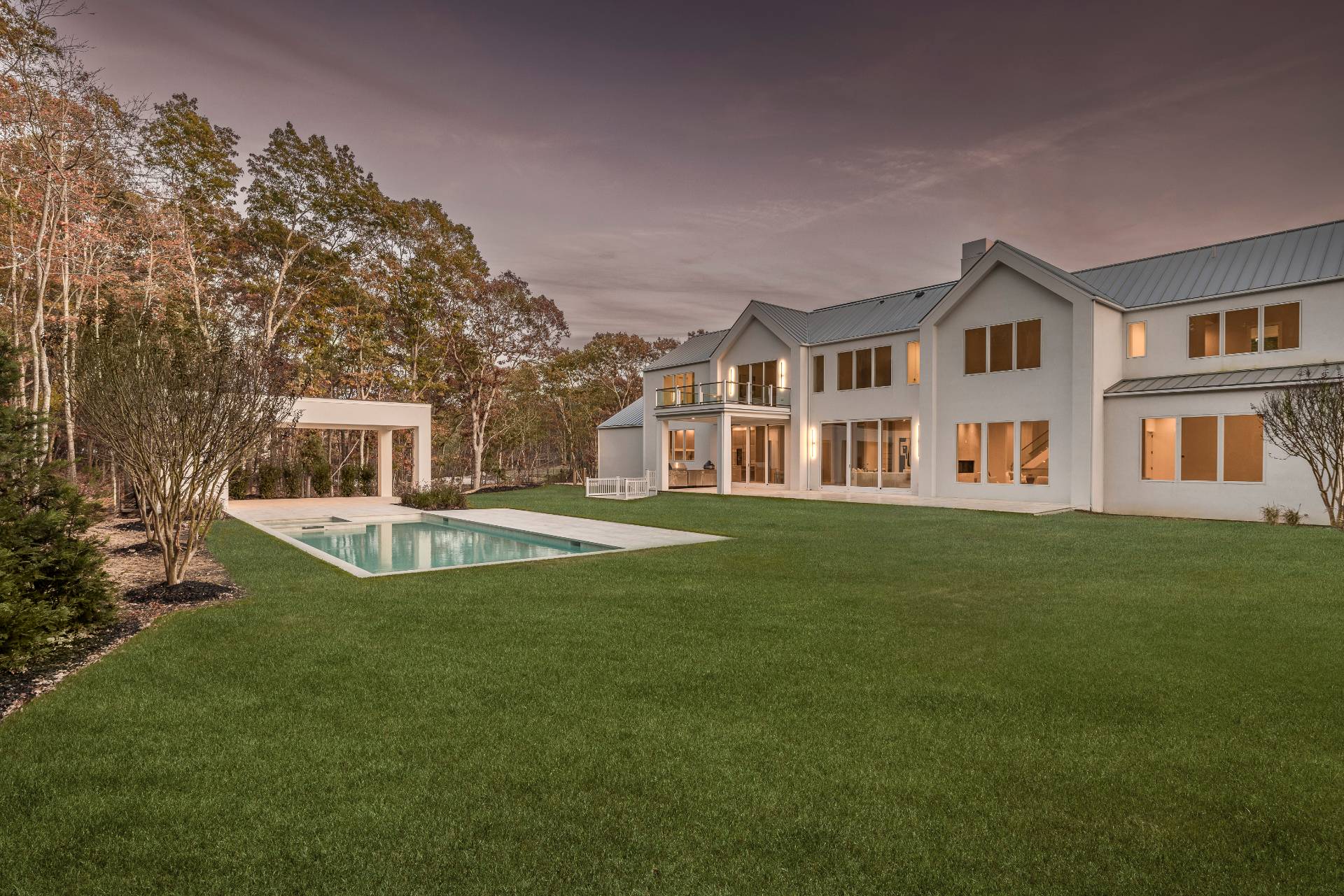 2069 Deerfield Road Sag Harbor, NY 11963 - Photo 31 of 37 a view of a house with a swimming pool