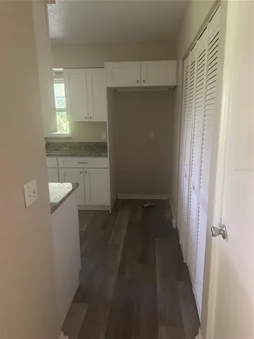 a view of a kitchen from the hallway