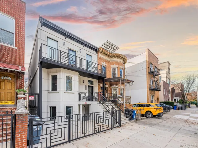 a view of a brick building with many windows