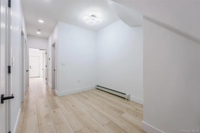 a view of room with hardwood floor