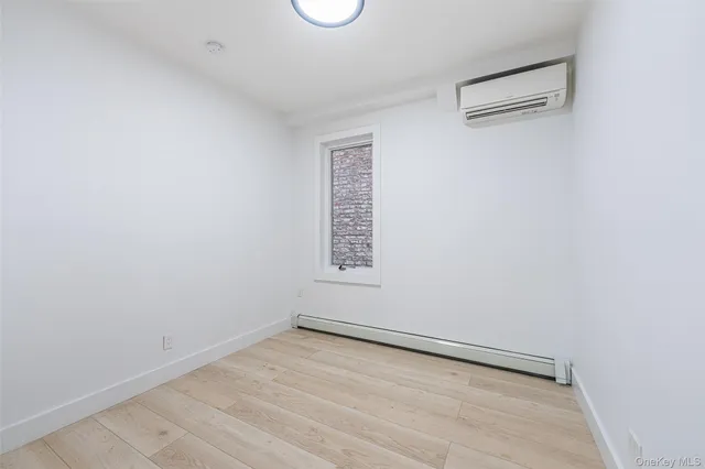 an empty room with a empty space and a window