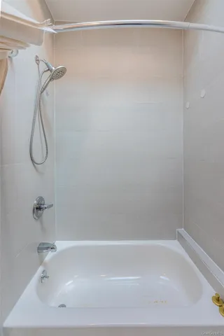a bathroom with a shower and a shower