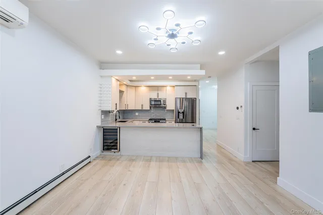 a view of kitchen with sink and window
