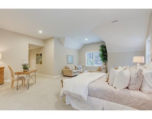 28 Hickory Hill Road Wayland, MA 01778 - Photo 18 of 30 a bedroom with a bed and a chair