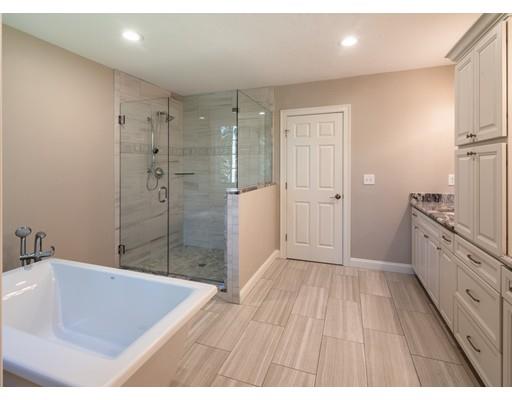 28 Hickory Hill Road Wayland, MA 01778 - Photo 20 of 30 a bathroom with a tub shower vanity and a sink