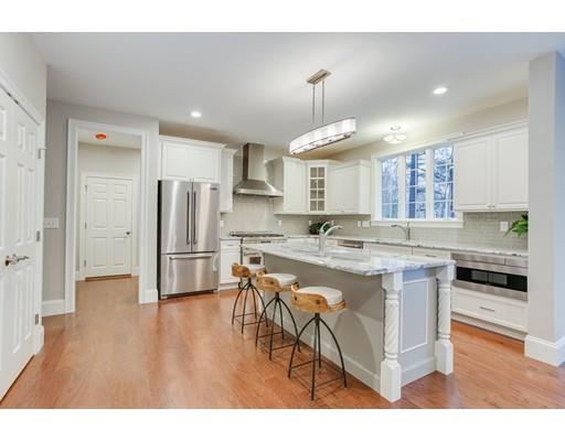 28 Hickory Hill Road Wayland, MA 01778 - Photo 7 of 30 a kitchen with stainless steel appliances a refrigerator and a stove top oven