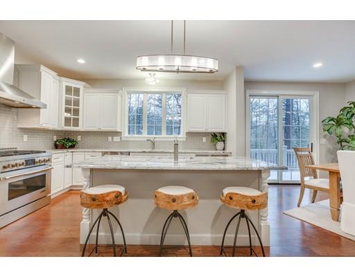28 Hickory Hill Road Wayland, MA 01778 - Photo 8 of 30 a kitchen with stainless steel appliances granite countertop a stove and cabinets