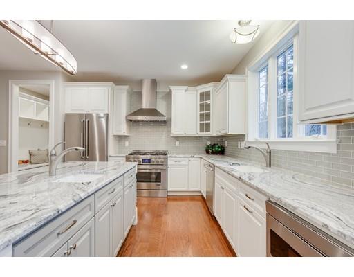 28 Hickory Hill Road Wayland, MA 01778 - Photo 9 of 30 a kitchen with stainless steel appliances granite countertop a sink stove and refrigerator