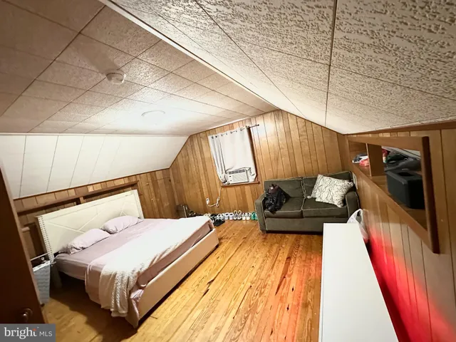 a bed room with a bed and a couch