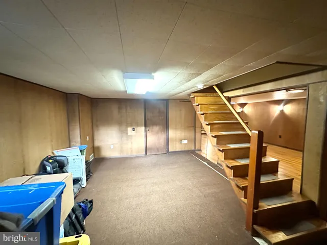 a view of an empty room with stairs