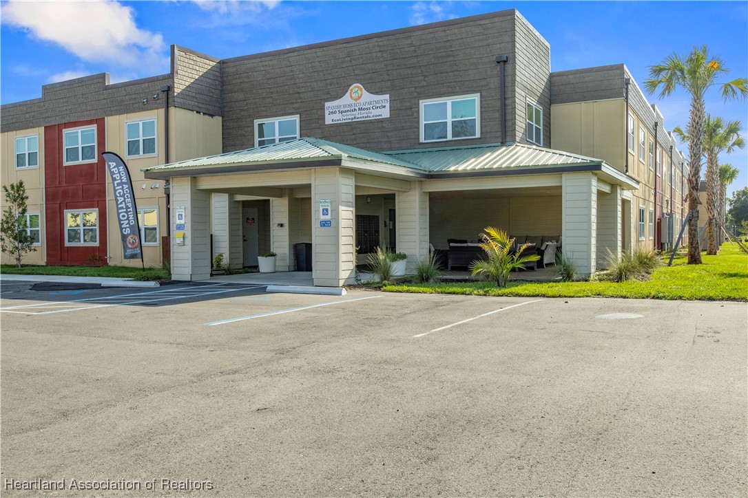 260 Spanish Moss Circle, Unit 101 Sebring, FL 33876 - Photo 1 of 35 a view of a brick building with many windows