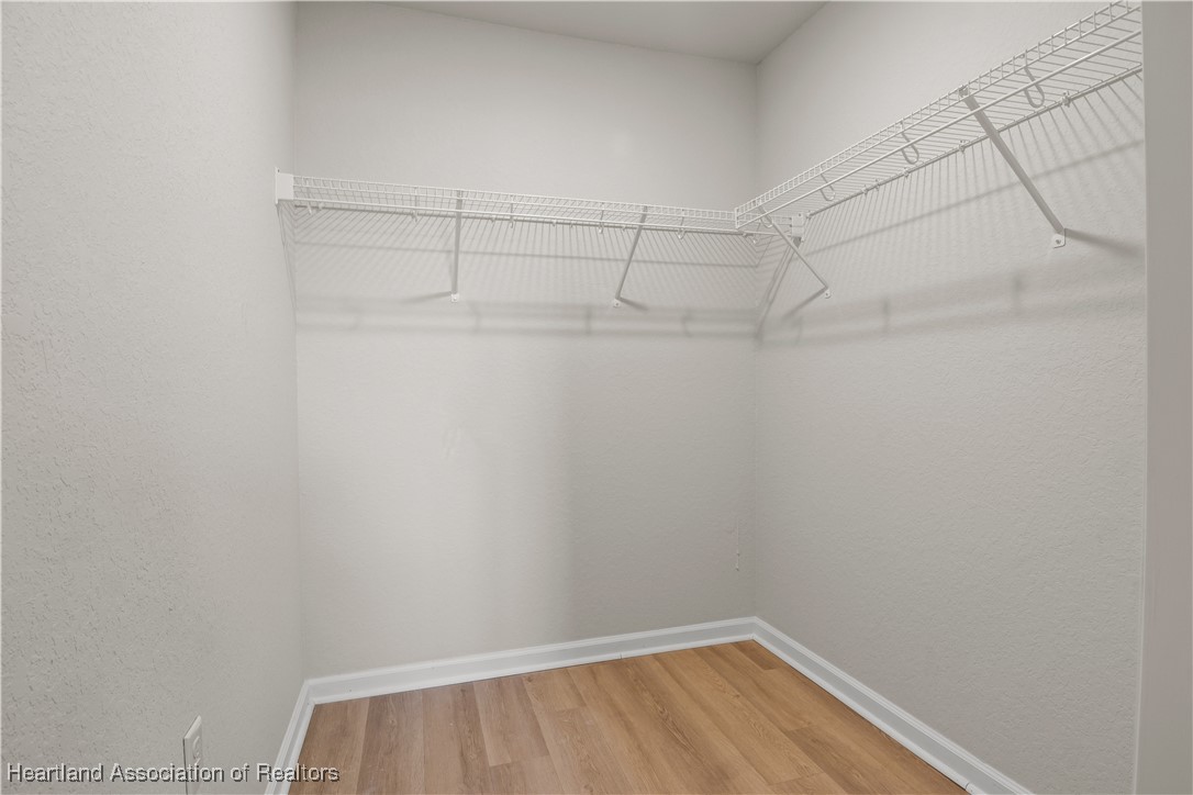 260 Spanish Moss Circle, Unit 101 Sebring, FL 33876 - Photo 11 of 35 a view of a room with racks on the wall