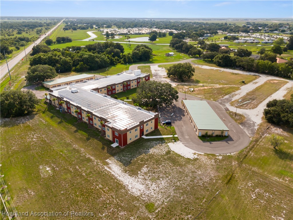 260 Spanish Moss Circle, Unit 101 Sebring, FL 33876 - Photo 19 of 35 an aerial view of residential houses with outdoor space