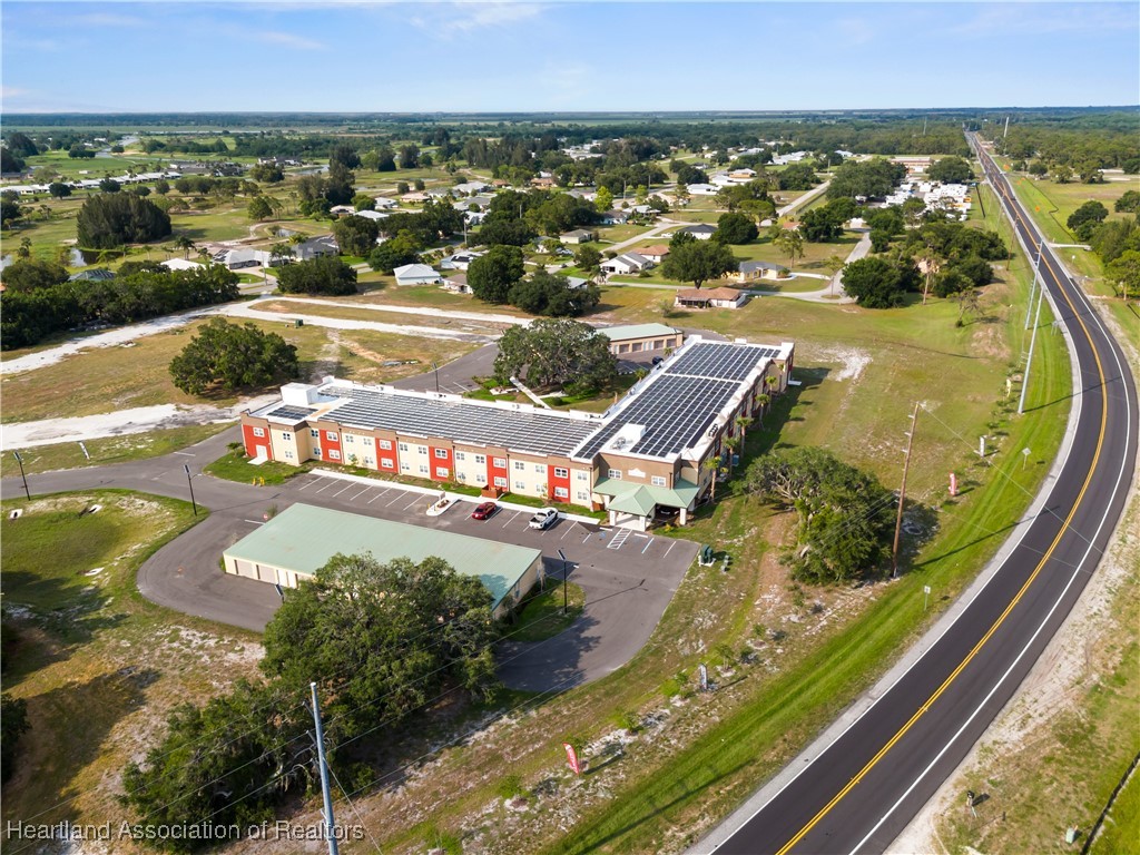 260 Spanish Moss Circle, Unit 101 Sebring, FL 33876 - Photo 20 of 35 an aerial view of a swimming pool and outdoor seating