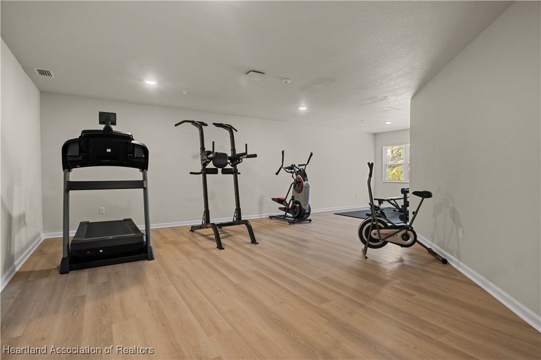 260 Spanish Moss Circle, Unit 101 Sebring, FL 33876 - Photo 26 of 35 a view of a room with gym equipment