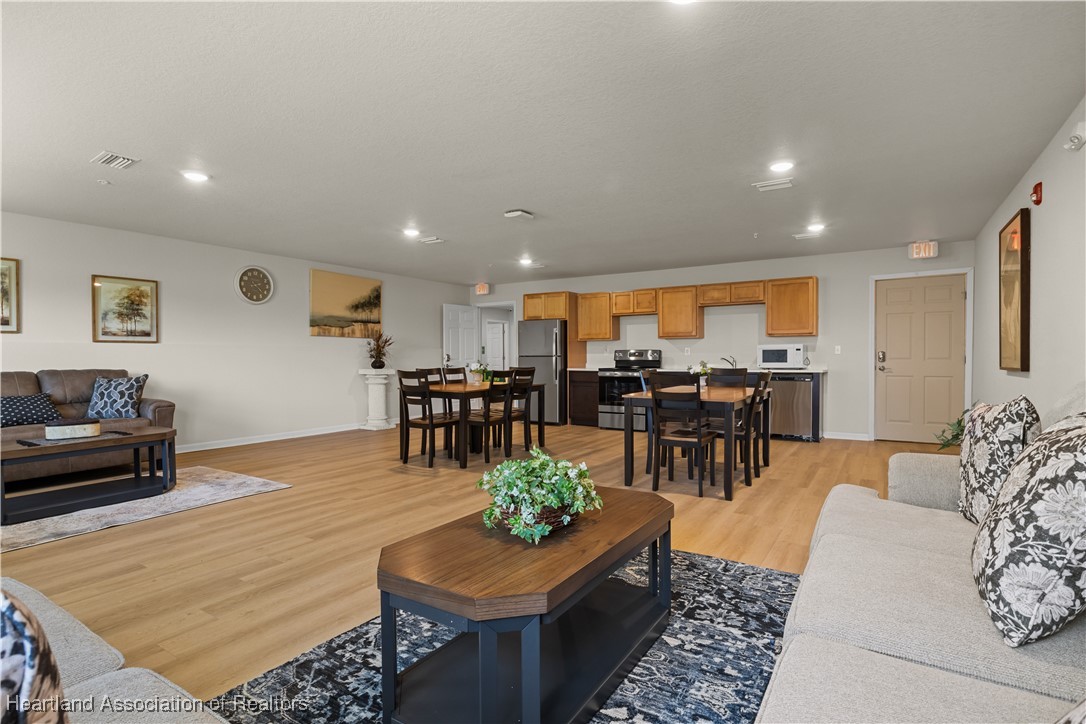 260 Spanish Moss Circle, Unit 101 Sebring, FL 33876 - Photo 35 of 35 a living room with furniture and a table