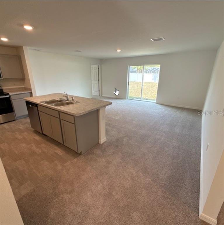 31 Pine Cedar Drive Palm Coast, FL 32164 - Photo 2 of 15 a living room with a couch and a window