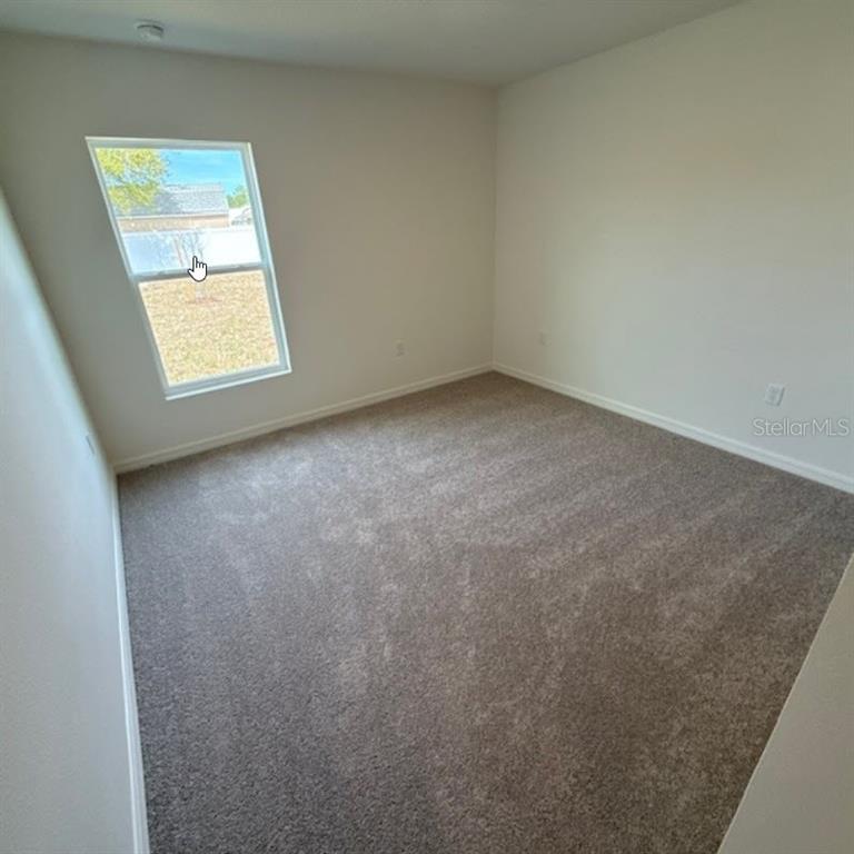 31 Pine Cedar Drive Palm Coast, FL 32164 - Photo 7 of 15 an empty room with a window