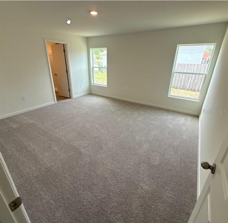 31 Pine Cedar Drive Palm Coast, FL 32164 - Photo 10 of 15 an empty room with windows