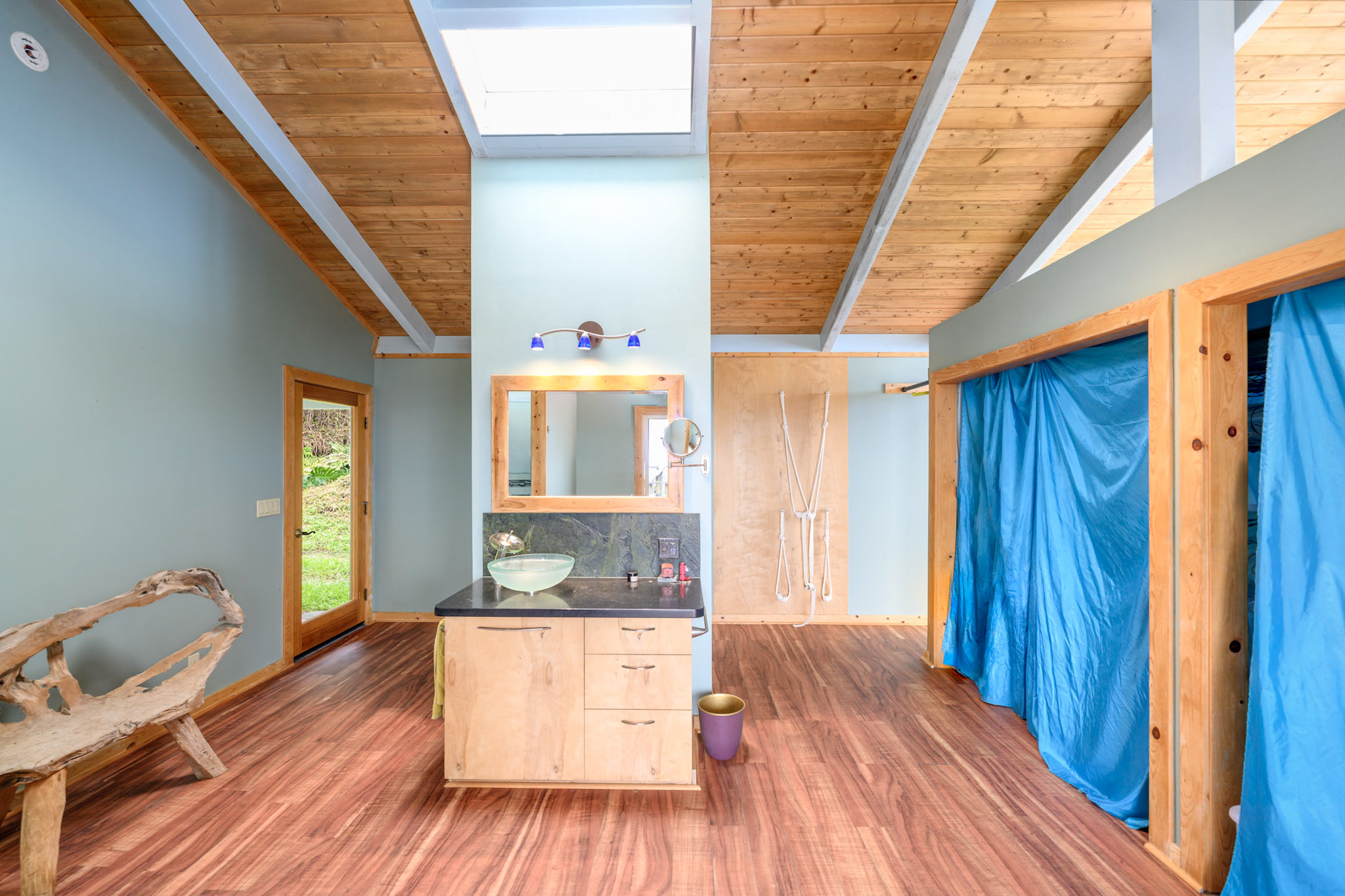 84 Private Road Captain Cook, HI 96704 - Photo 7 of 29 a room with wooden floors and furniture
