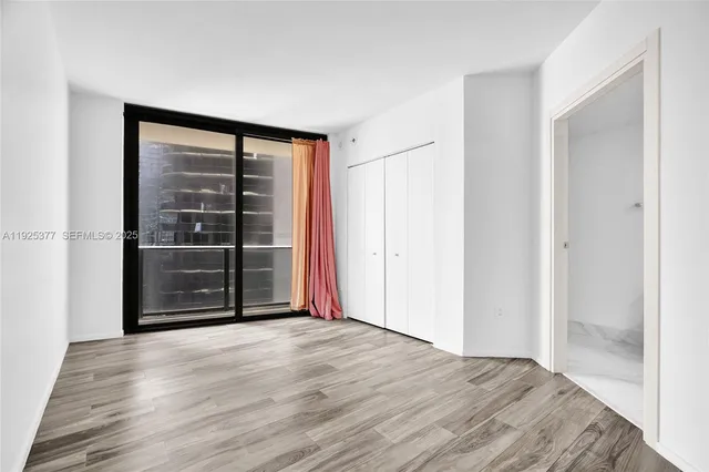 a view of wooden floor and wooden door