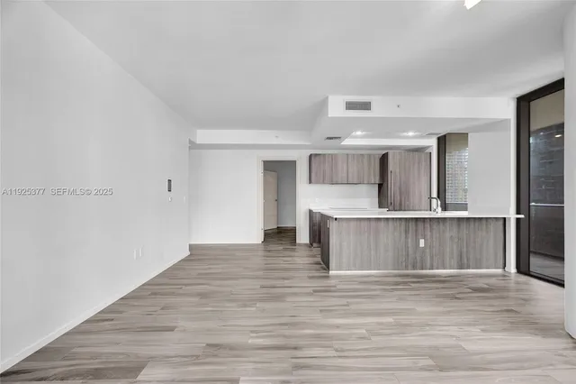 a view of kitchen with wooden floor