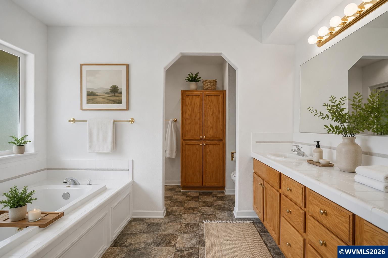 1299 Twin Hills Road Southeast Jefferson, OR 97352 - Photo 26 of 47 a bathroom with a tub sink and mirror