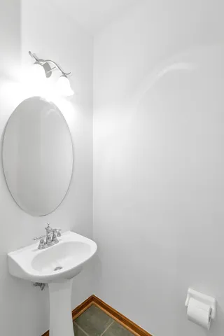 a bathroom with a sink and mirror