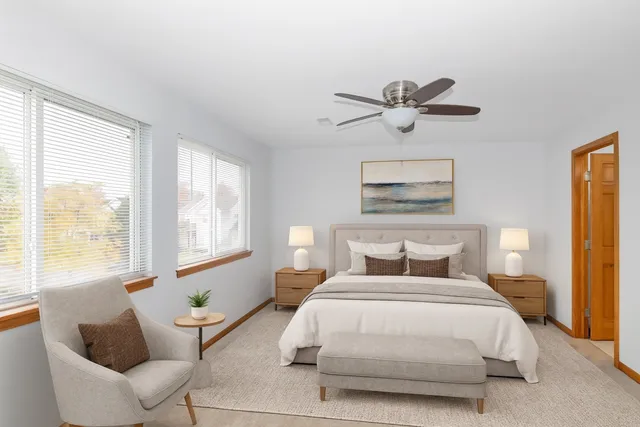 a bedroom with a bed and window