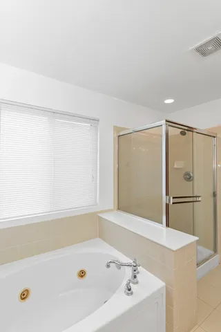 a bathroom with a bathtub and a sink