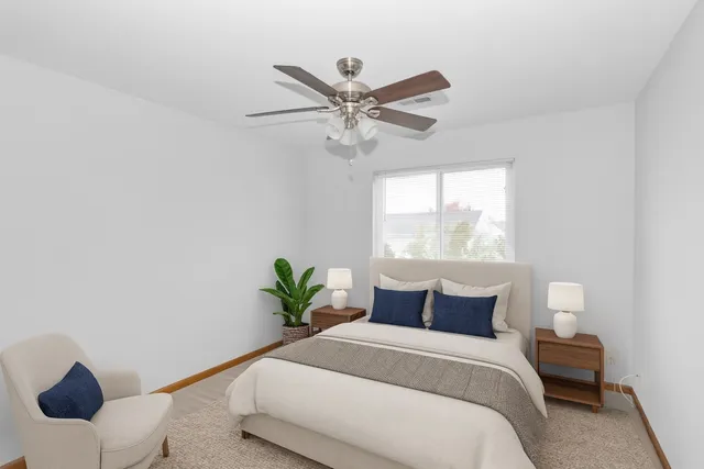 a bedroom with a bed and window