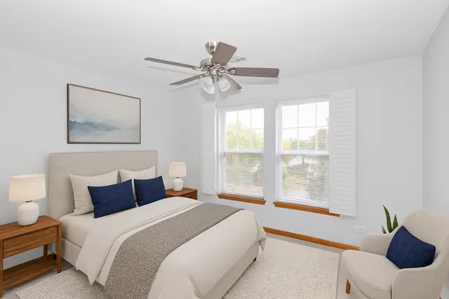 a bedroom with a large bed and a window