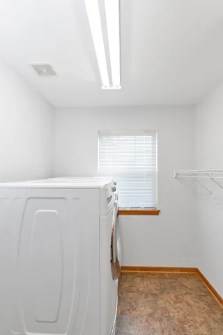 a view of walk in closet with window