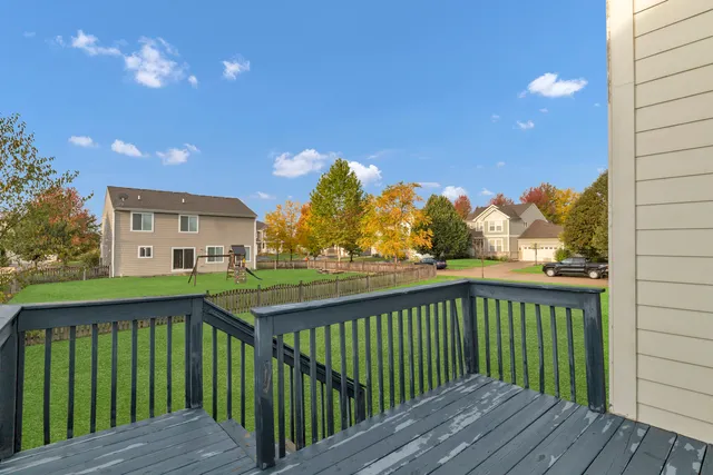 a view of a balcony with wooden floor