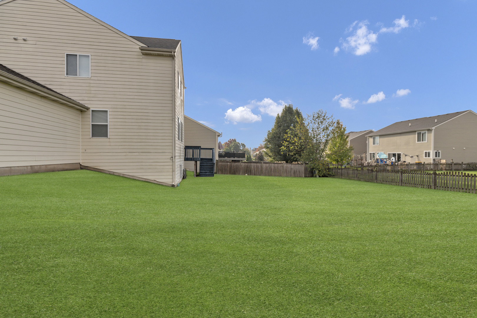3311 Lafayette Street Elgin, IL 60124 - Photo 49 of 50 a view of a backyard with plants and large trees