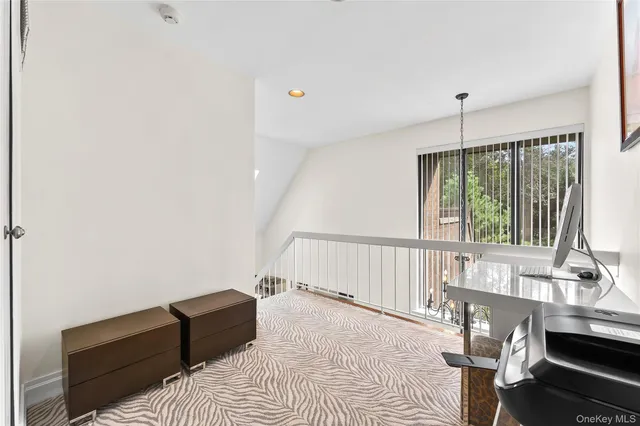 a bedroom with furniture and a window