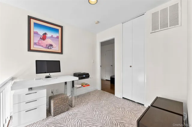 a room with a bed and a desk