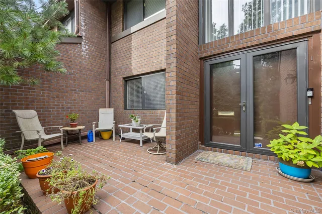 a view of a chairs with a table and chair in the patio