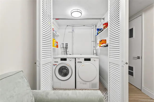 a utility room with dryer and washer