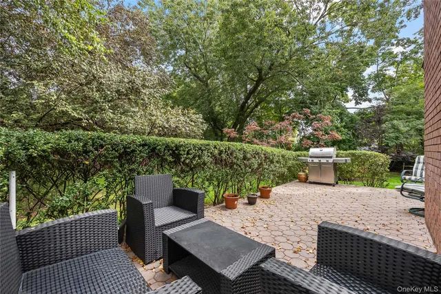 swimming pool view with a seating space