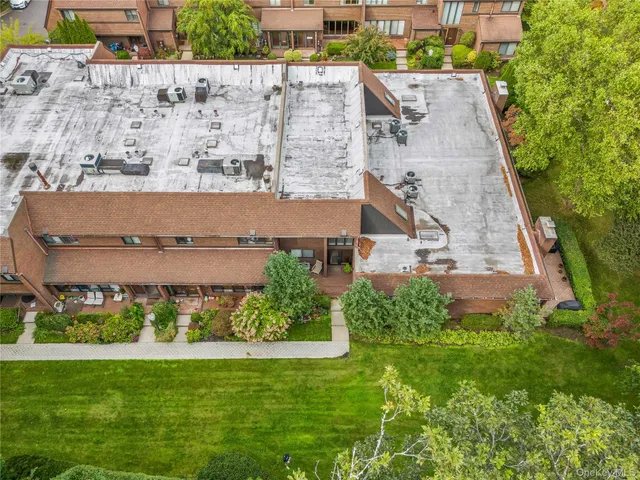 an aerial view of a house with a garden
