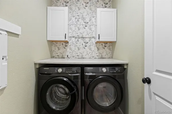 a utility room with dryer and washer
